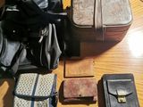 several pieces of luggage sitting on top of a wooden table