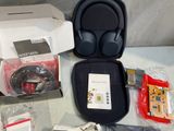 a box of earphones and other electronics sitting on a table