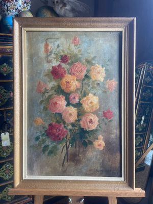 a picture of a painting on a easel in a room