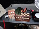 a table with a chess board and a cell phone on it