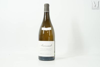 a bottle of wine that is sitting on a table