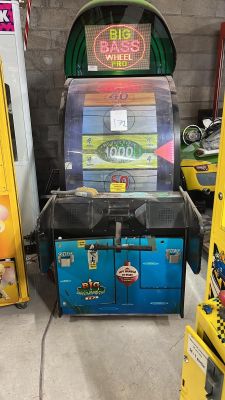 two arcade machines in a room with yellow lockers