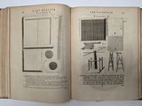 an open book with a drawing of a computer on it