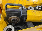 a yellow tool box filled with different types of tools