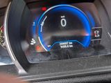a close up of a car ' s dashboard with a speedometer