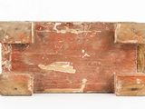 an old wooden box that is sitting on a white surface