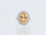 une bague sertie d'une citrine de taille ovale et de diamants