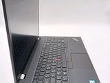 a laptop with a keyboard on it sitting on a table