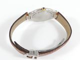 an image of a wrist watch with a brown leather band