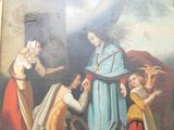 a painting on the wall of a building that has a painting of a woman in a blue dress