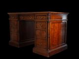 an antique wooden desk with drawers and drawers on top of it