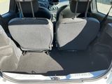 two seats in the back of a small car