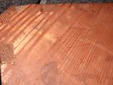someone is using a pair of scissors to cut a piece of wood