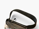 black and white purse with a tag attached to it on a white surface