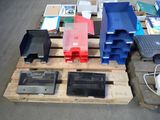 many different types of plastic parts on a pallet