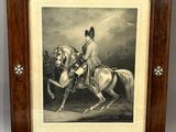 an old picture of a man riding a horse in a wood frame