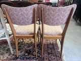pair of mid century style chairs with upholstered back cushions