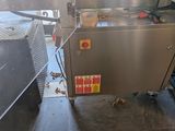 une image d'une machine qui se trouve dans une cuisine