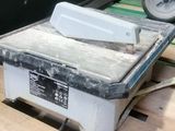 a white box sitting on top of a wooden pallet