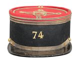 a black hat with a red and gold number on it