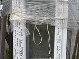 a white door with a window on top of a pallet