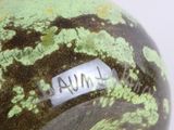 a close up of a vase with a label on it