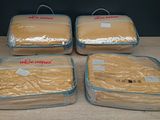 four bags of food are wrapped in plastic on a table