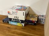 a stack of books sitting on top of a wooden table