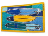 yellow beach towel with surfboards on it on a blue and green background