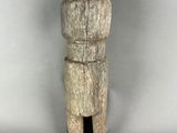 an image of a small wooden object on a white surface