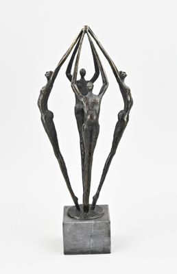 an image of a bronze sculpture of three people holding hands