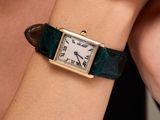 a woman that is wearing a watch on her wrist