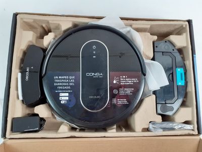 emballage d'une boîte contenant un aspirateur robot et un chargeur