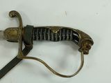 a sword that is laying on a white surface
