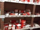 many shelves with boxes and boxes on them in a store