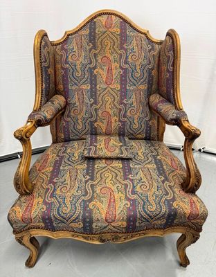 an old chair with colorful upholstered upholstered upholstered upholstered upholstered upholstered upholstered upholstered upholstered