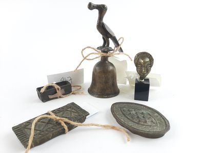 a bell and some items that are on a table