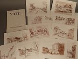 une pile de vieilles cartes postales sur lesquelles figurent des photos de bâtiments