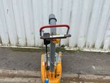 a yellow scooter parked on the side of the street
