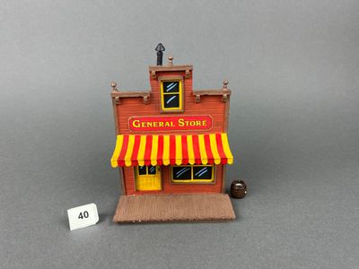 un petit magasin de jouets avec une enseigne sur la façade