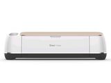 a close up of a cricut maker on a white background