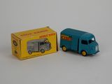 a toy truck and a box on a white surface
