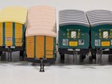 a toy train that is sitting on a white surface
