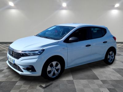 a white car is parked in a room with a checkered floor