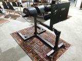 a machine that is sitting on a rug in a room