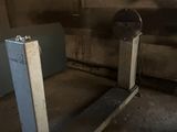 a small bed in the middle of a dirty room