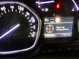a close up of a car dashboard with a speedometer