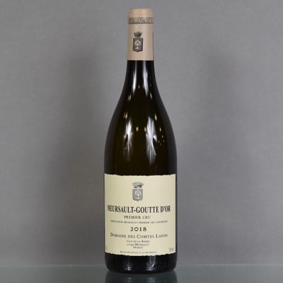 a bottle of wine that is sitting on a table