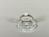 an image of a ring with a pearl on it