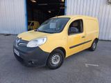the yellow van is parked in front of a building